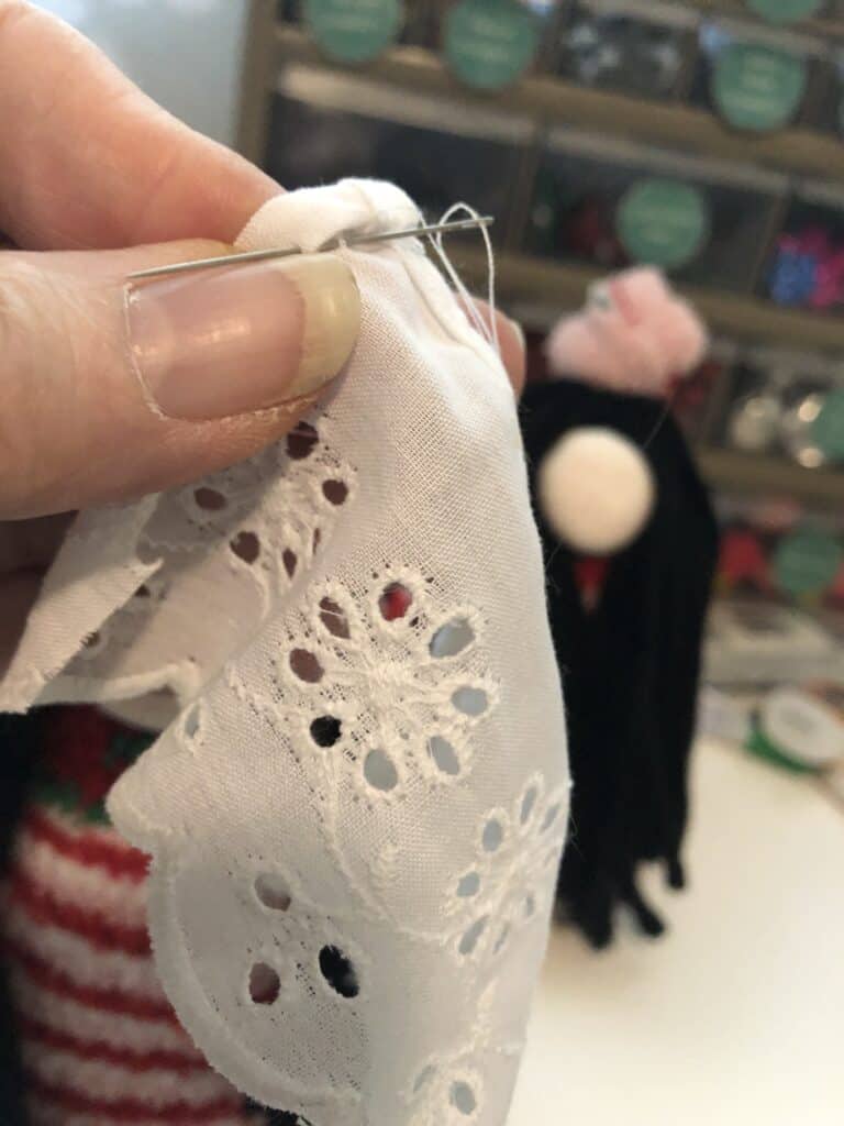 Step 1:  Measure a piece of lace, cut it, and saw the edges.