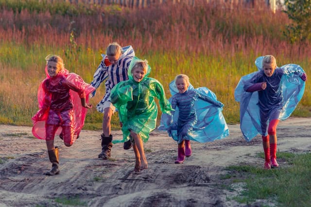 Children running in the rain by Vitolda Klein from Unsplash